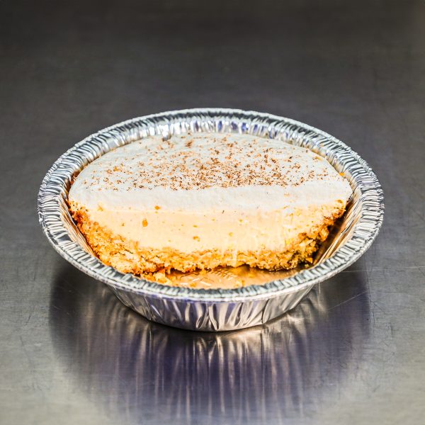 Lemon Pie with shortbread crust, lemon pudding, and a fluffy cream topping.