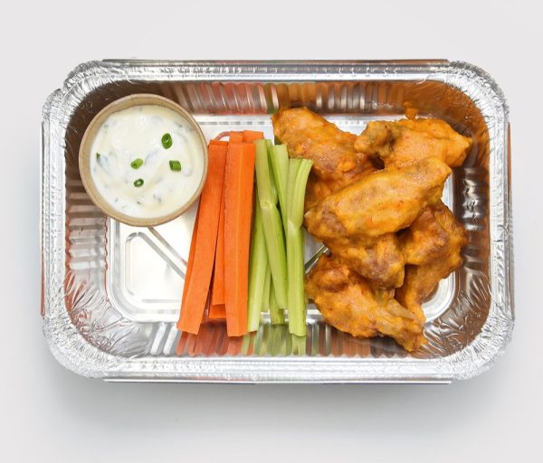 Golden, crispy chicken wings served with ranch sauce, celery, and carrot sticks.